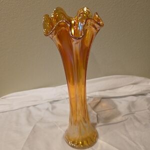 Vintage marigold carnival glass swung vase with a ribbed pattern